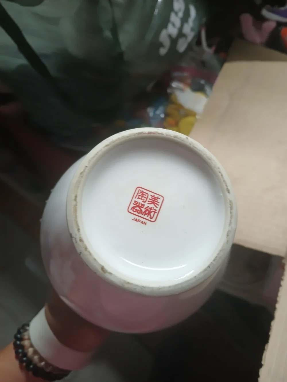 vintage Japanese white porcelain ginger jar featuring a metallic inlaid medallio
